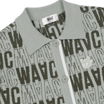 Short-sleeve cardigan with an all-over WAAC pattern
Contrast stripe trim at the cuffs and placket
Light knit texture for everyday wear