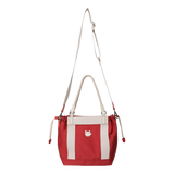 Color Tote Bag
with a two-tone panel design
Front slogan print and WAACKY emblem
Functional compartments for daily carry