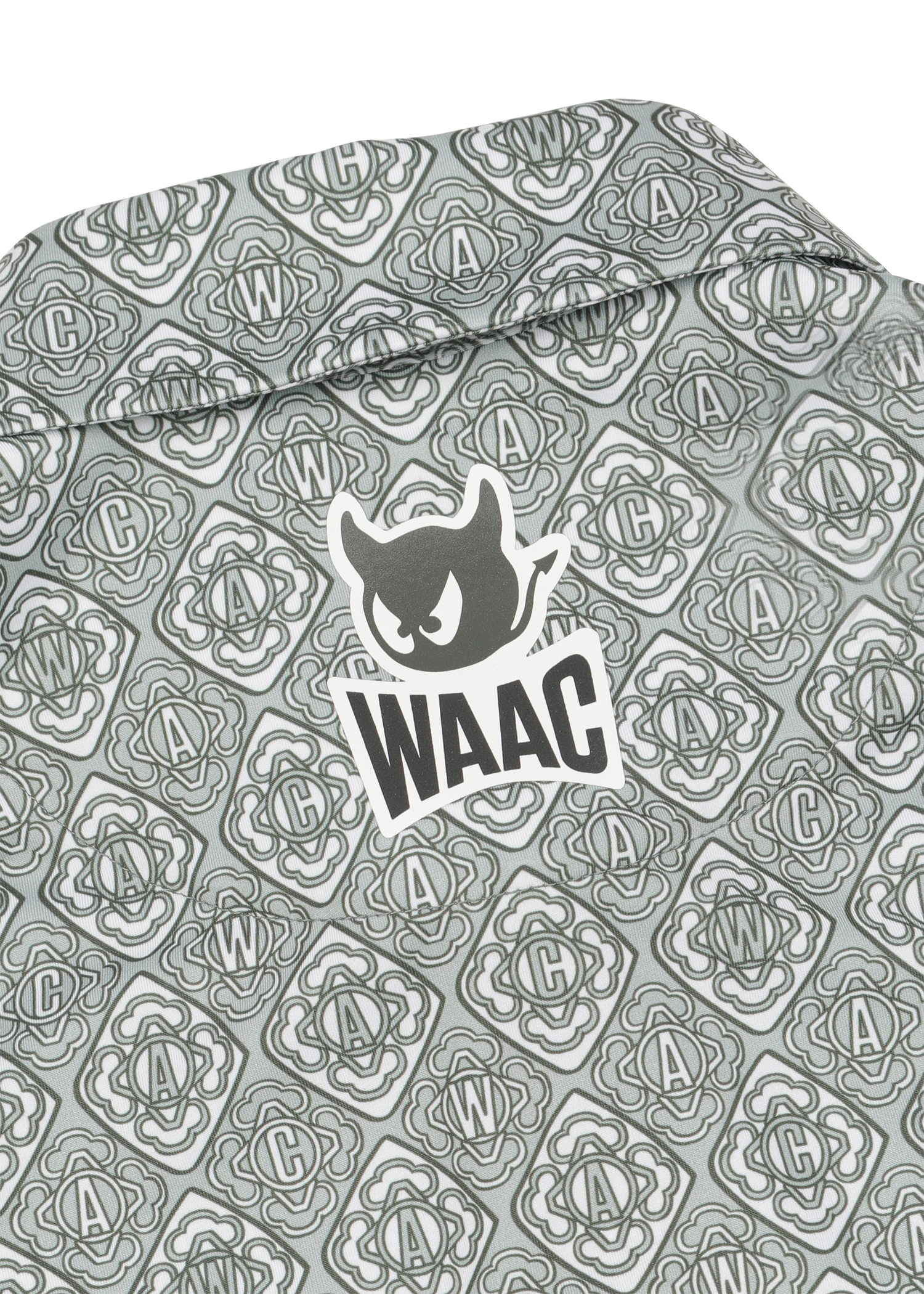 Lightweight stretch polo with a K monogram pattern
Front WAAC logo detail
Subtle sleeve graphic point