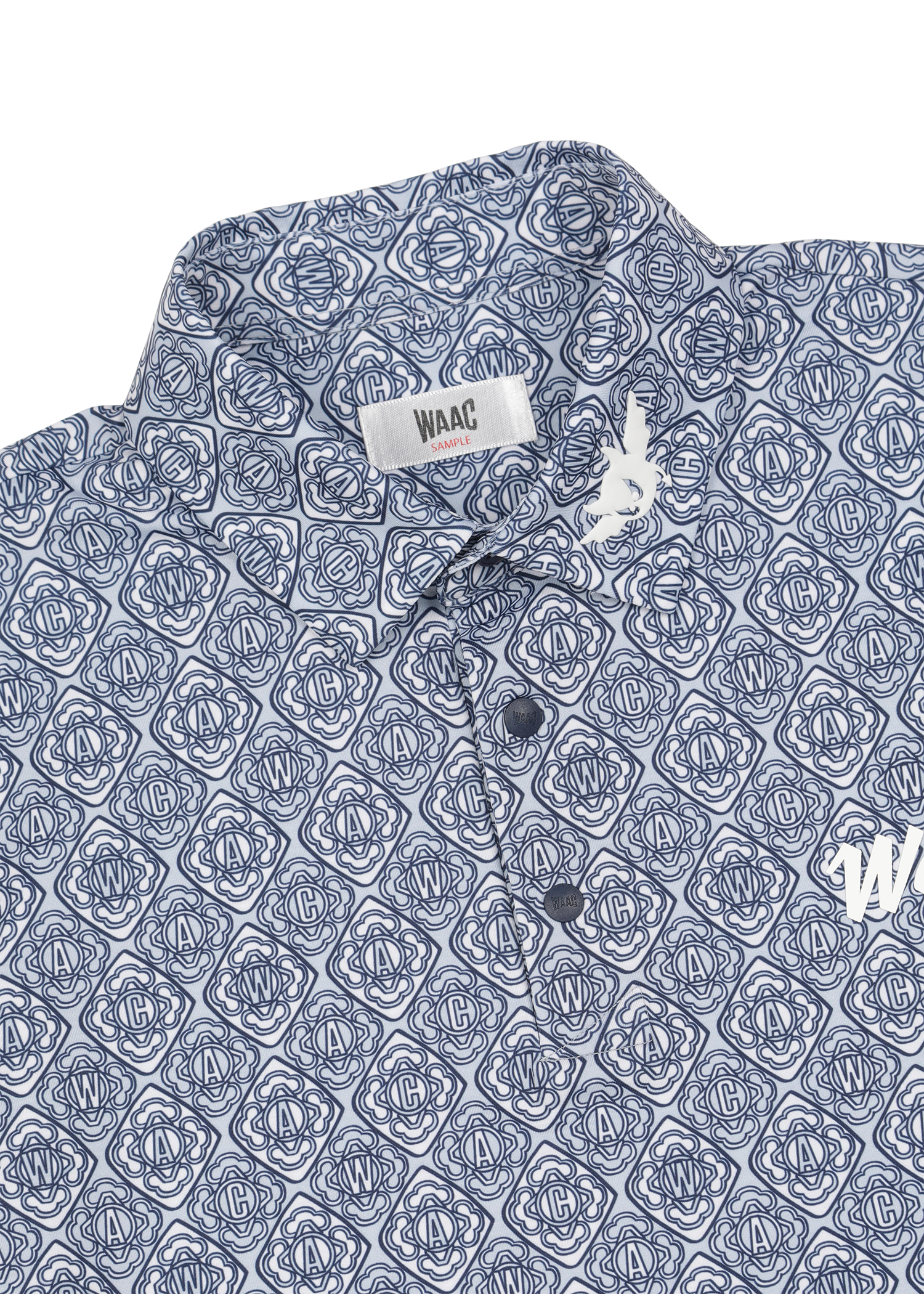 Lightweight stretch polo with a K monogram pattern
Front WAAC logo detail
Subtle sleeve graphic point
