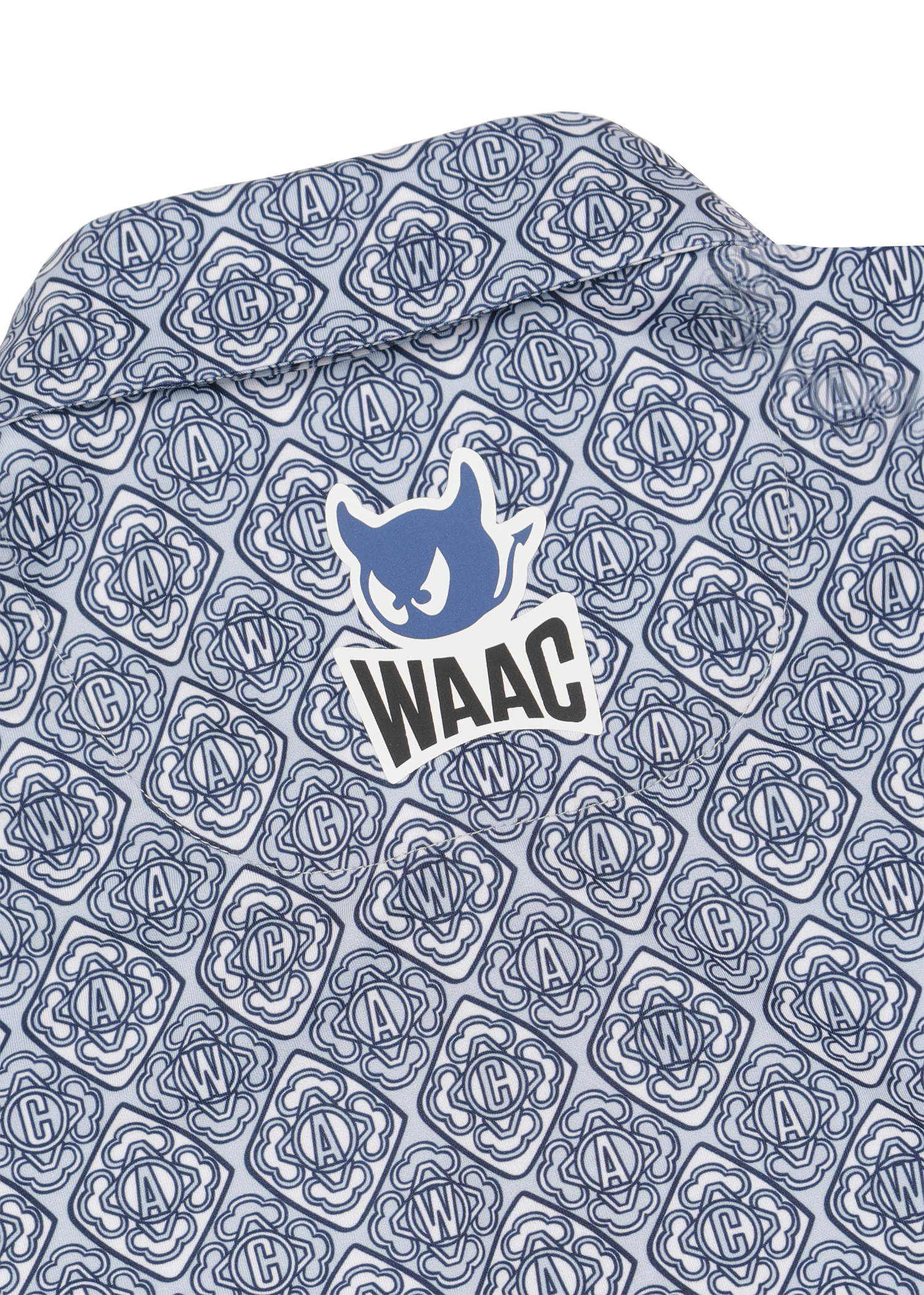 Lightweight stretch polo with a K monogram pattern
Front WAAC logo detail
Subtle sleeve graphic point